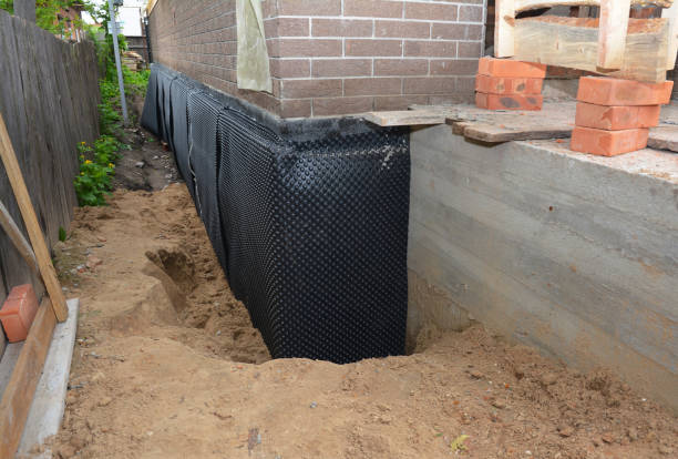 Happy homeowners after waterproofing job in Fair Haven